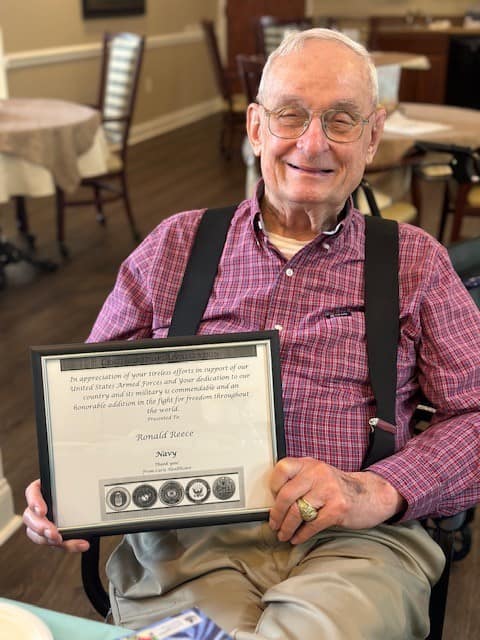 photo of Ron at Morning Pointe of Lenoir City with a certificate honoring his service