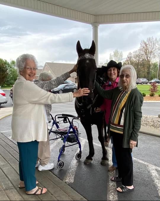 photo of Marcia sharing her horse Dallas with residents