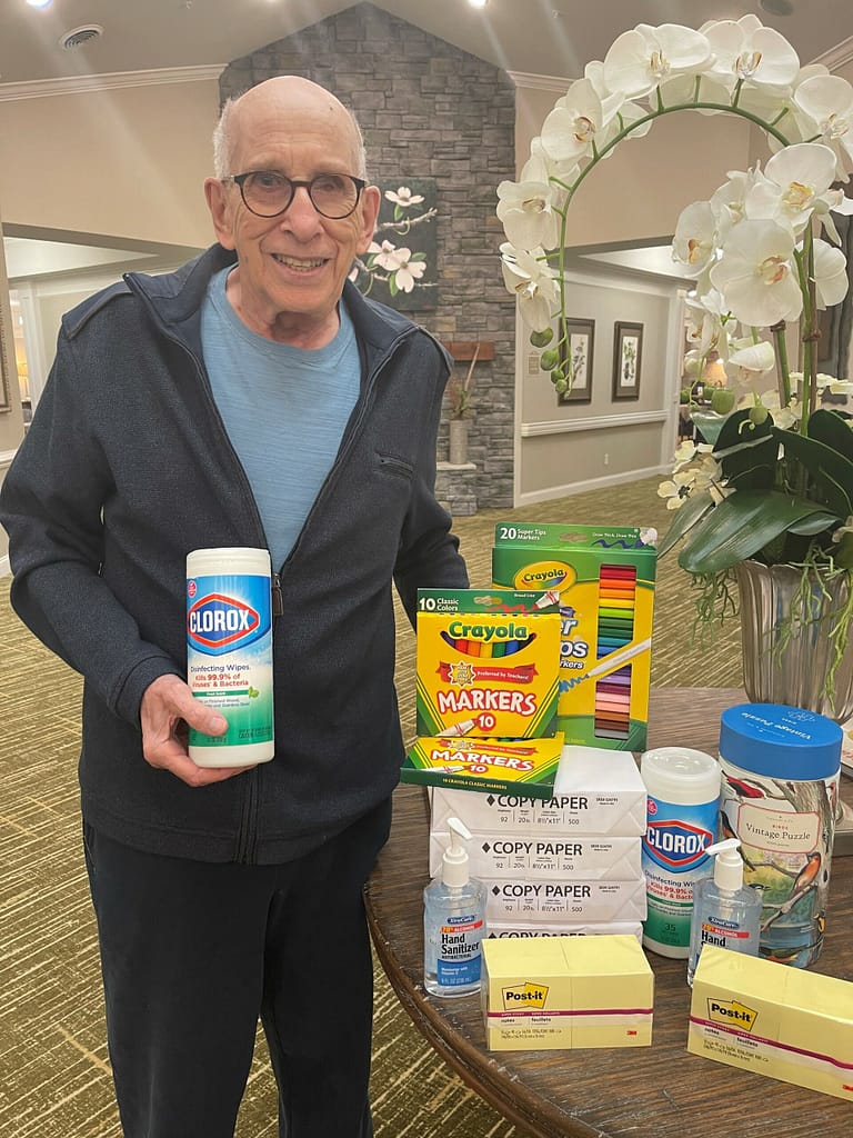 photo of Michael Sobel with school supplies at Morning Pointe of Chattanooga