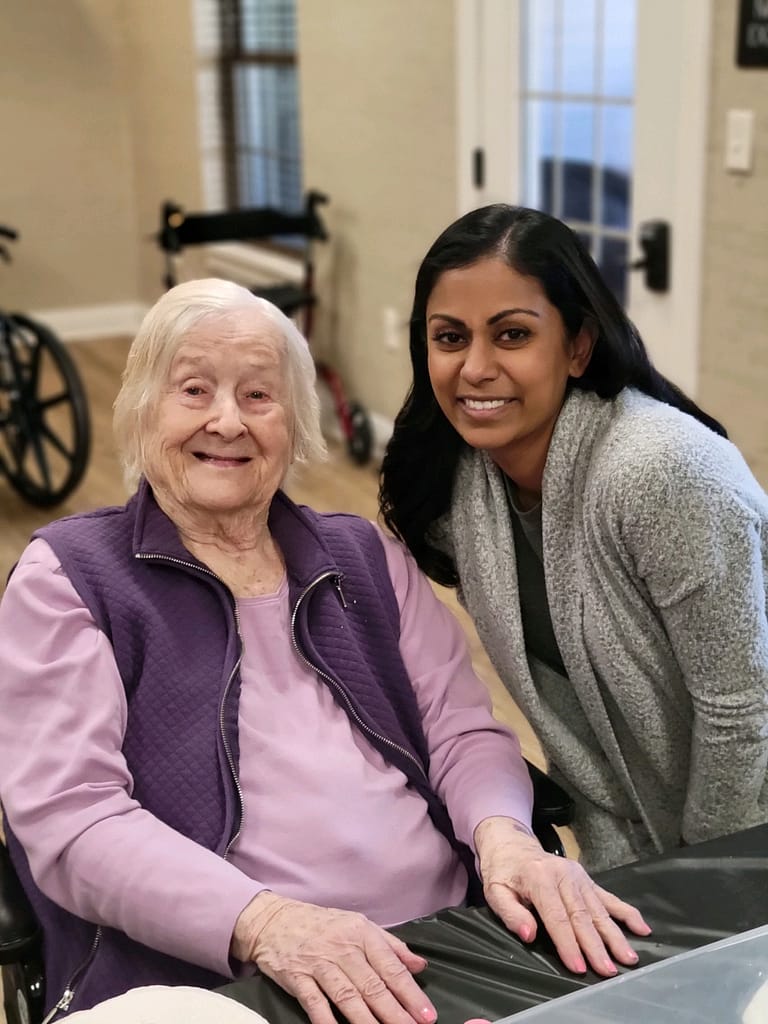 photo of one of the Tennessee Serves ladies with a resident