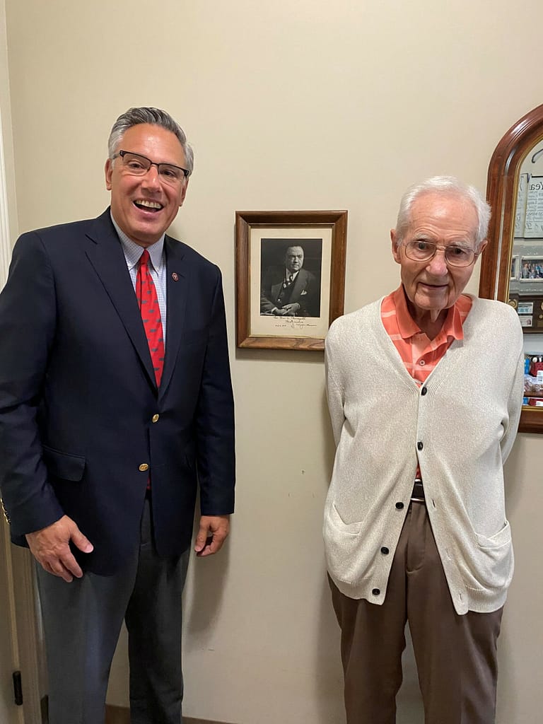 Photo of Don with Greg A. Vital, Co-Founder and President of Morning Pointe Senior Living, with Don’s photo of J. Edgar Hoover