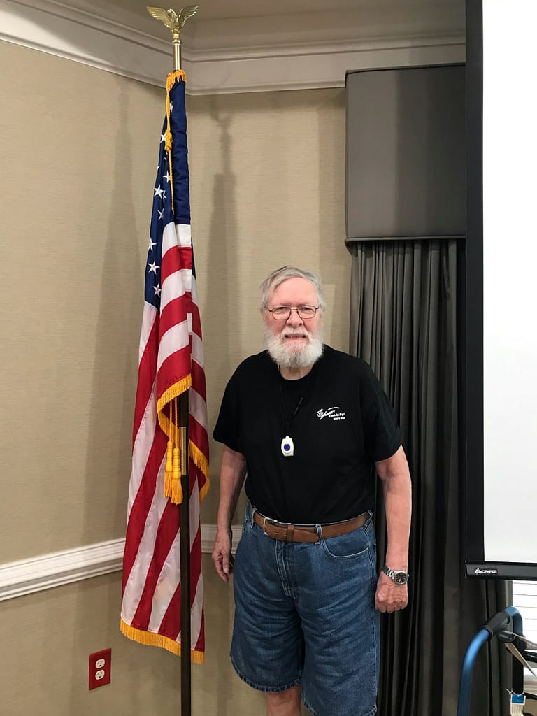 photo of Tom Wolfmeyer with the American flag