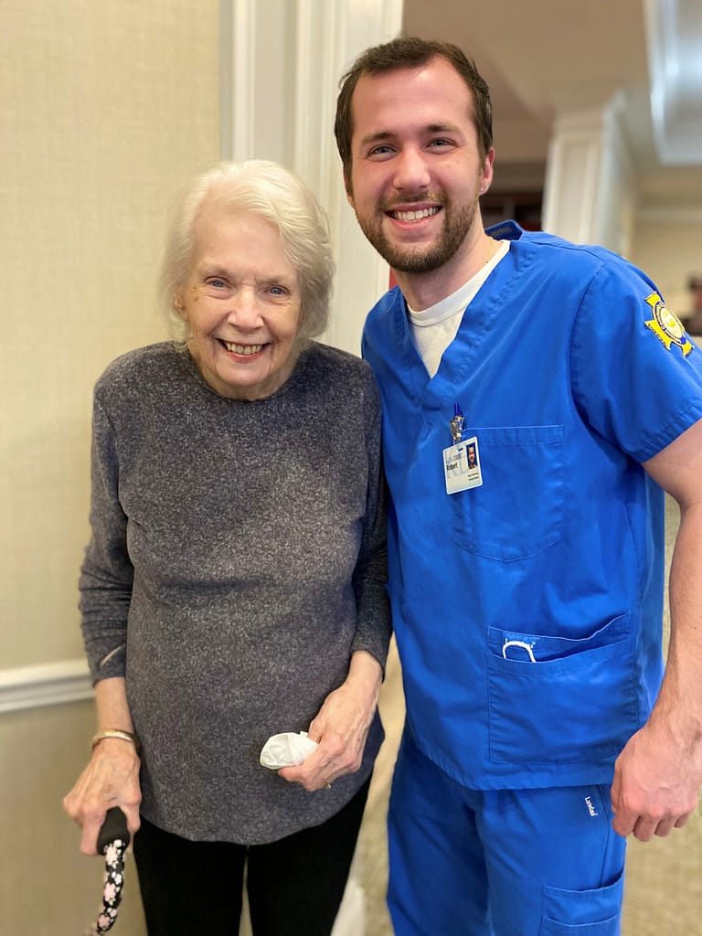 photo of student Robert McFarland with resident Alka Crews