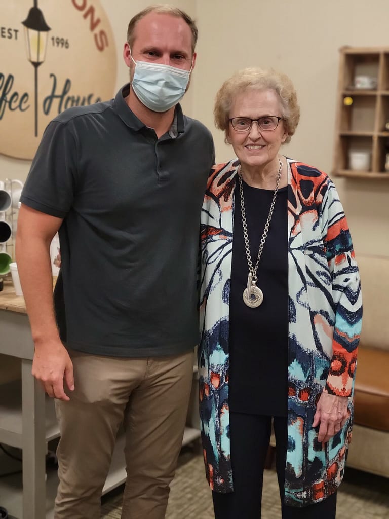 photo of Jared Fletcher, physical therapist with Amedisys, and resident Dolores Neal