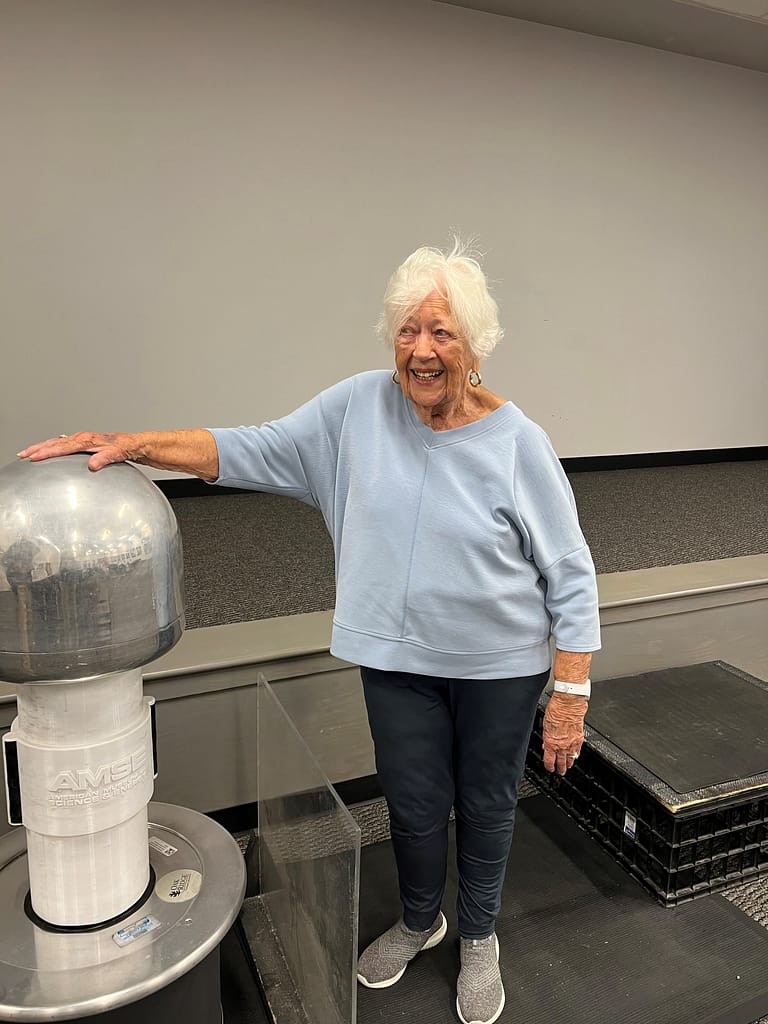 photo of Ann with the Van de Graaff machine on Morning Pointe of Powell's recent trip the the American Museum of Atomic Energy