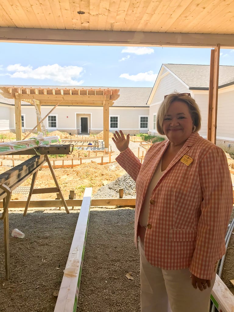 photo of Pam Turley, Executive Director, showing one of the courtyards