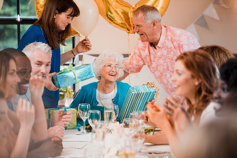 Senior woman in a senior living community enjoying her birthday party