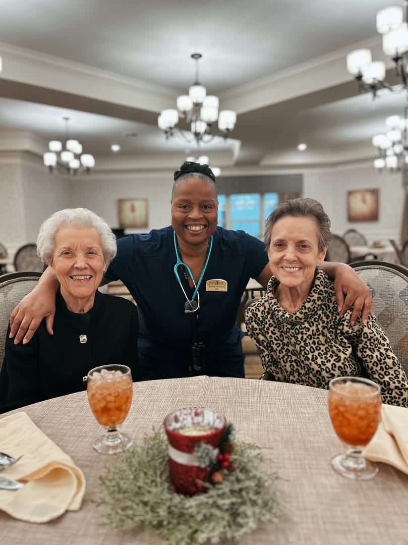 Photo of Morning Pointe at Happy Valley resident Doris Evans with her sister, Betty, and Licensed Practical Nurse Darnella McFarland