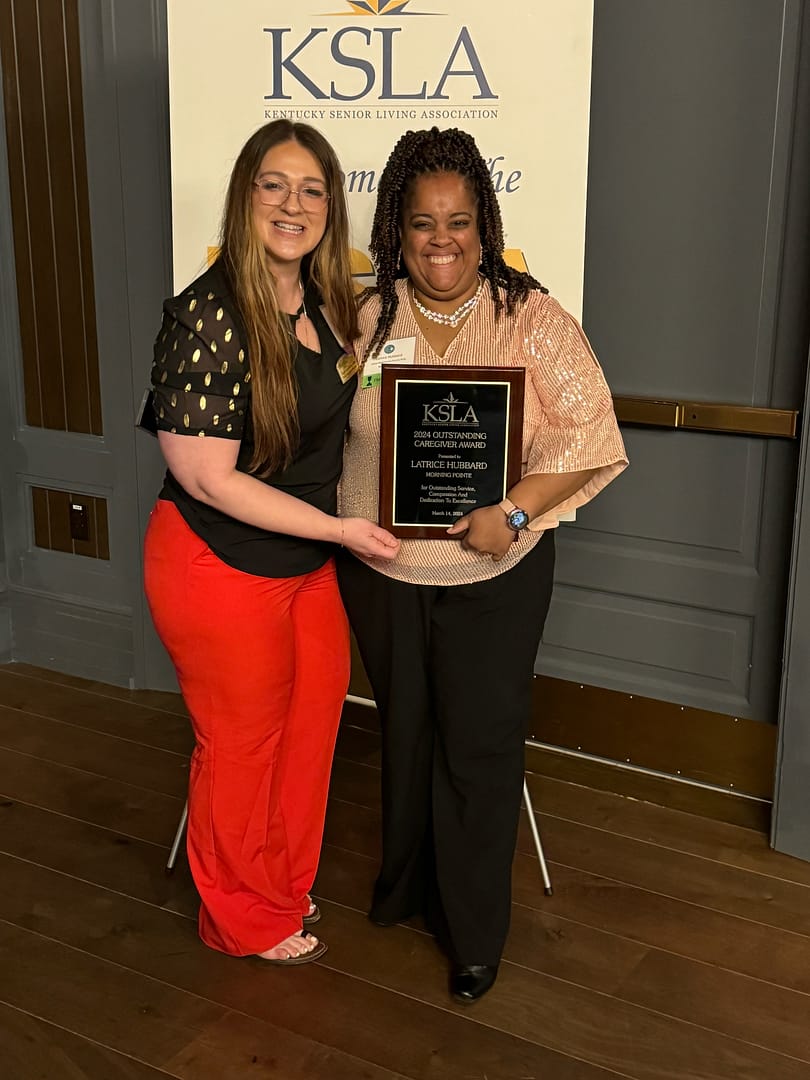 Photo of (right) Latrice Hubbard, CNA at Morning Pointe of Frankfort, KY, and winner of the Outstanding Caregiver Award, with (left) Amber Stansberry, executive director at Morning Pointe of Frankfort