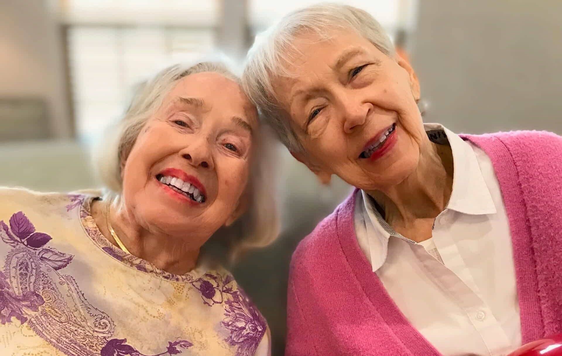 Two senior ladies smiling for selfie