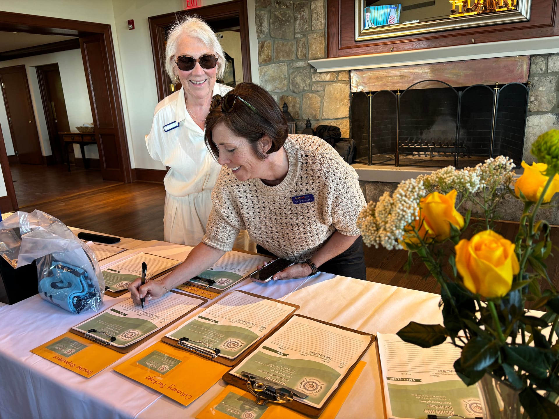 photo of guests viewing the silent auction items