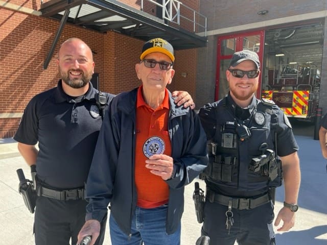 photo of Charlie Shannon with two Boyle County police officers