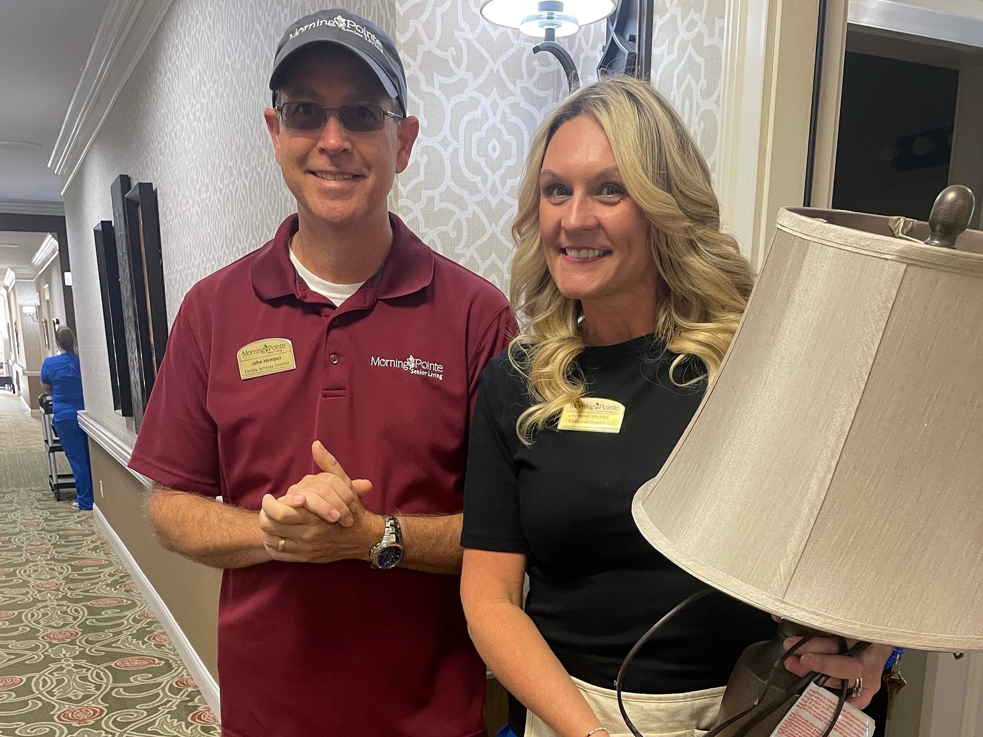 photo of John Hempel, Facilities Manager, and Lisa Keller, Executive Director, helping with Moving Day at Morning Pointe of Danville AL