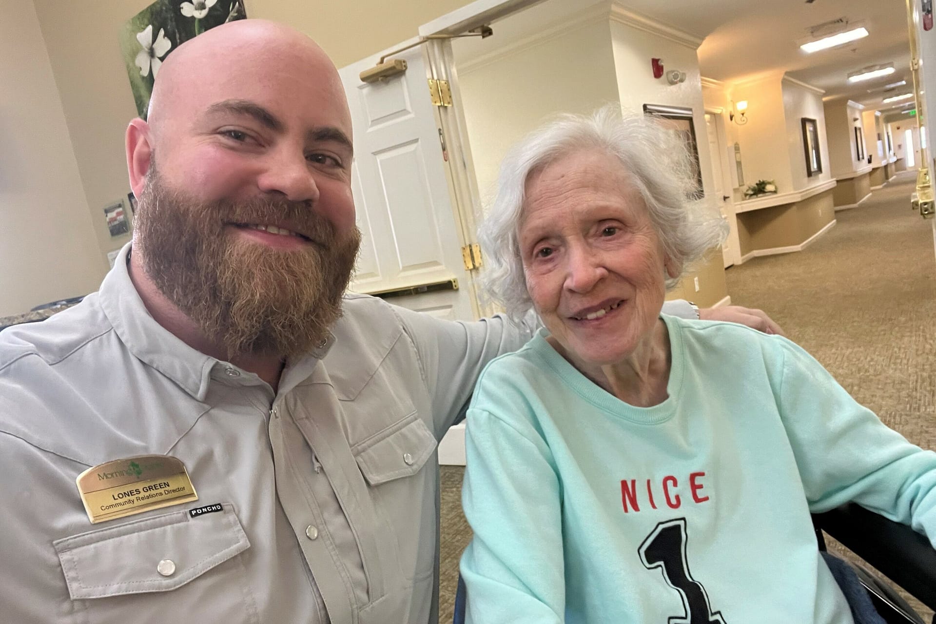 photo of Lones Green, Community Relations Director, with resident Janice