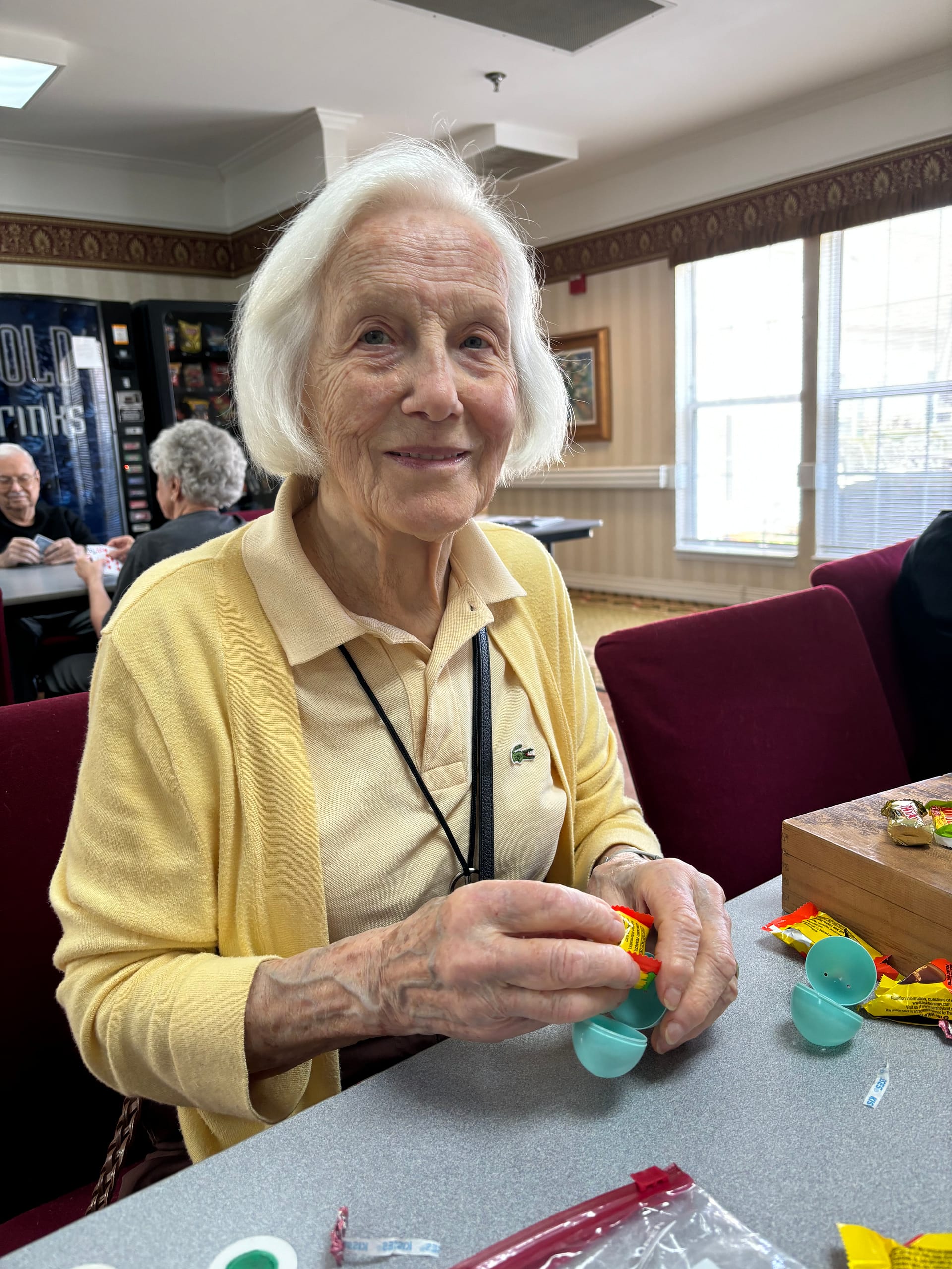 photo of Christel filling Easter eggs for children