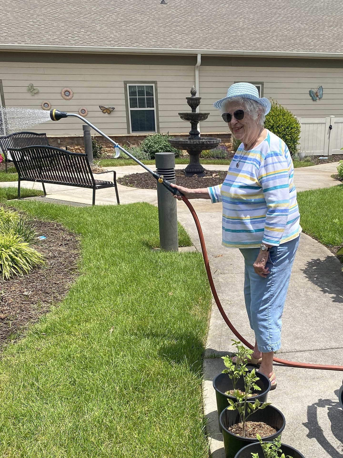 photo of Pat watering the garden