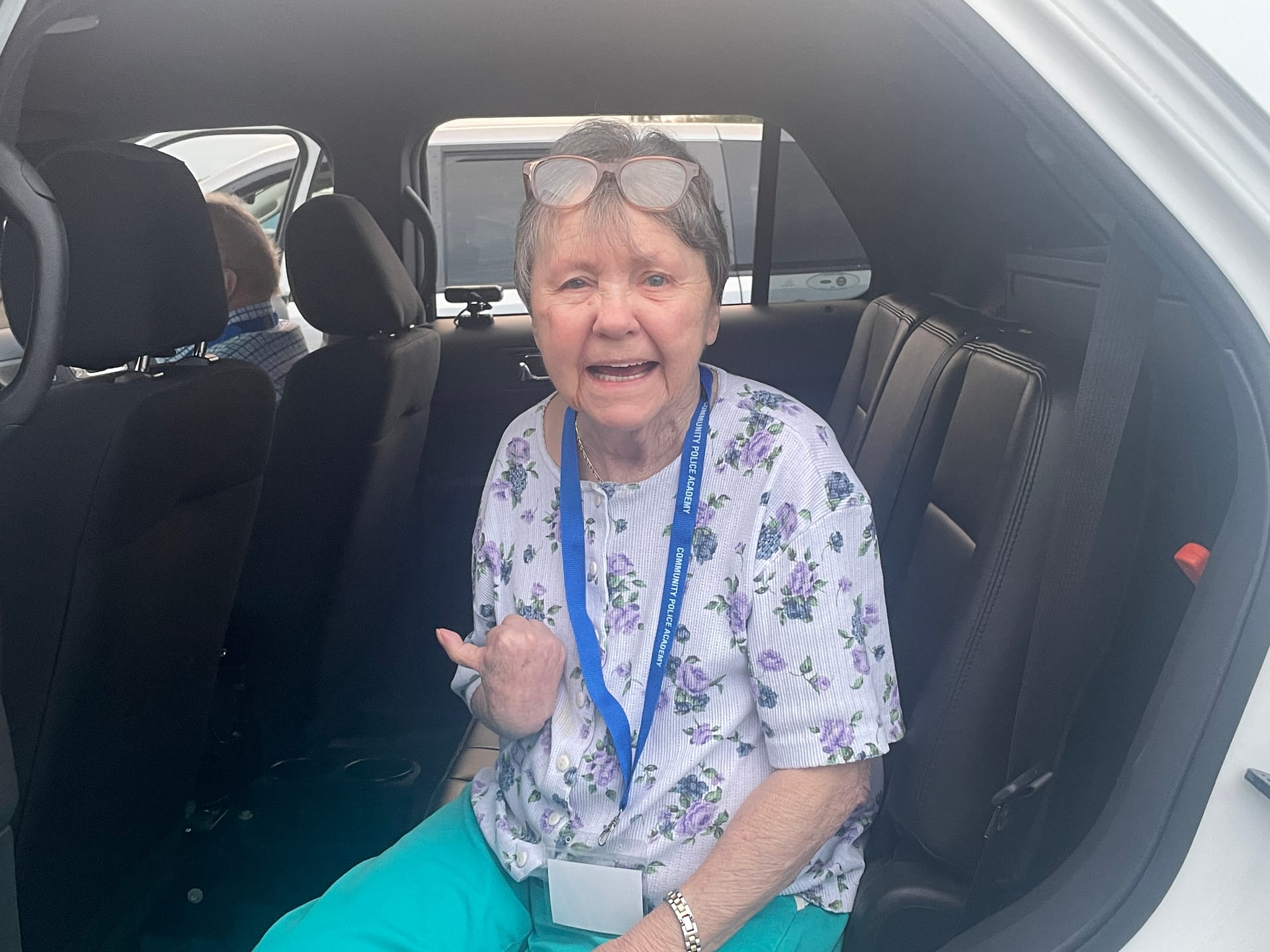 photo of Resident Beverly Troy in the police cruiser