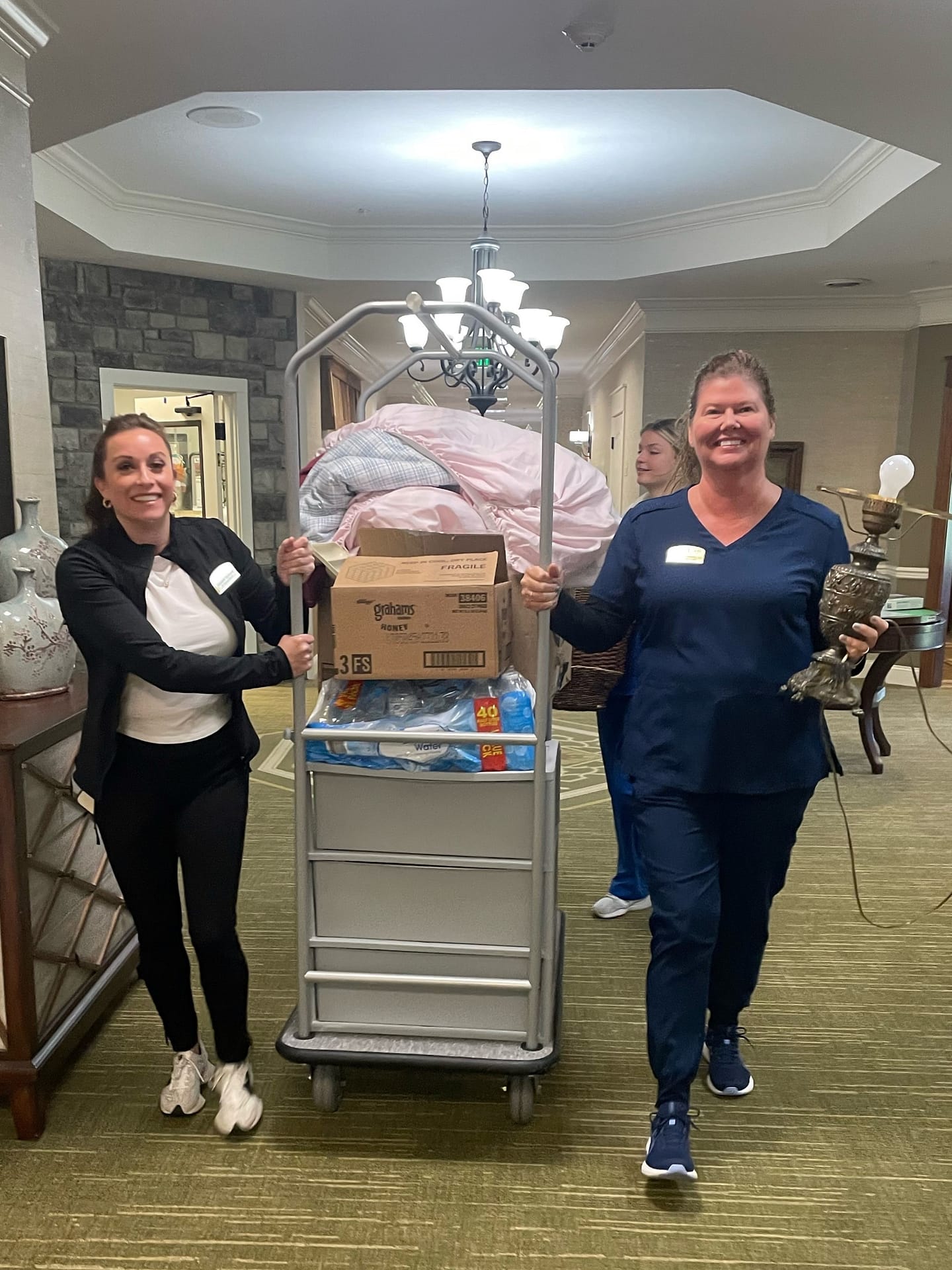 photo of associates helping residents move in