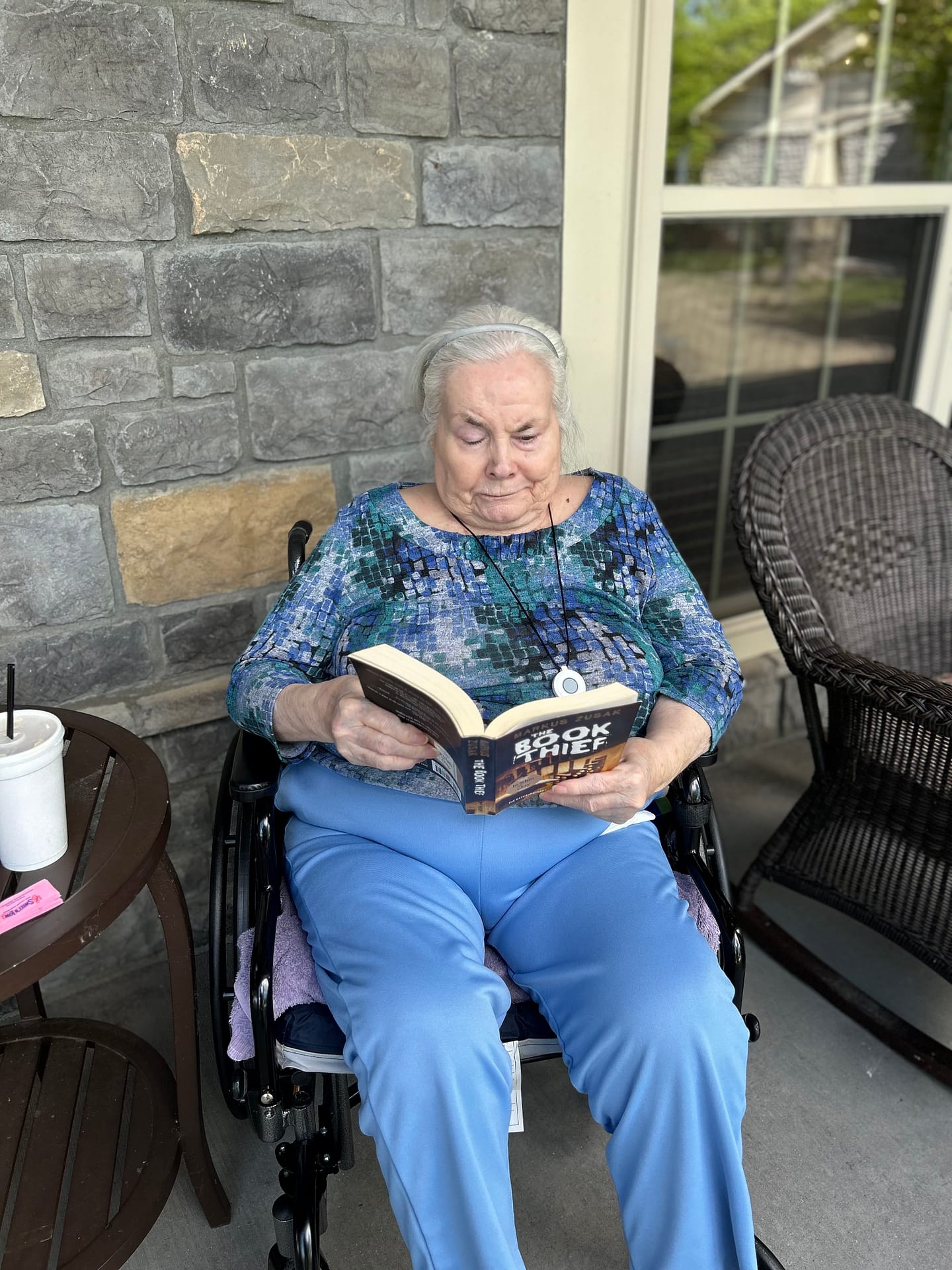 photo of Ingrid reading at Morning Pointe of Lexington-East