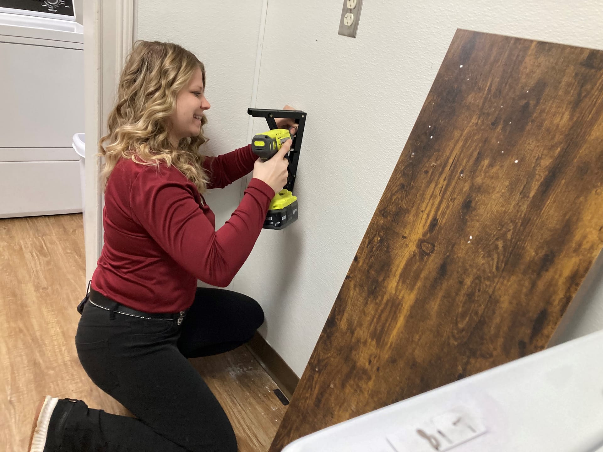 Shelby fixing a shelf