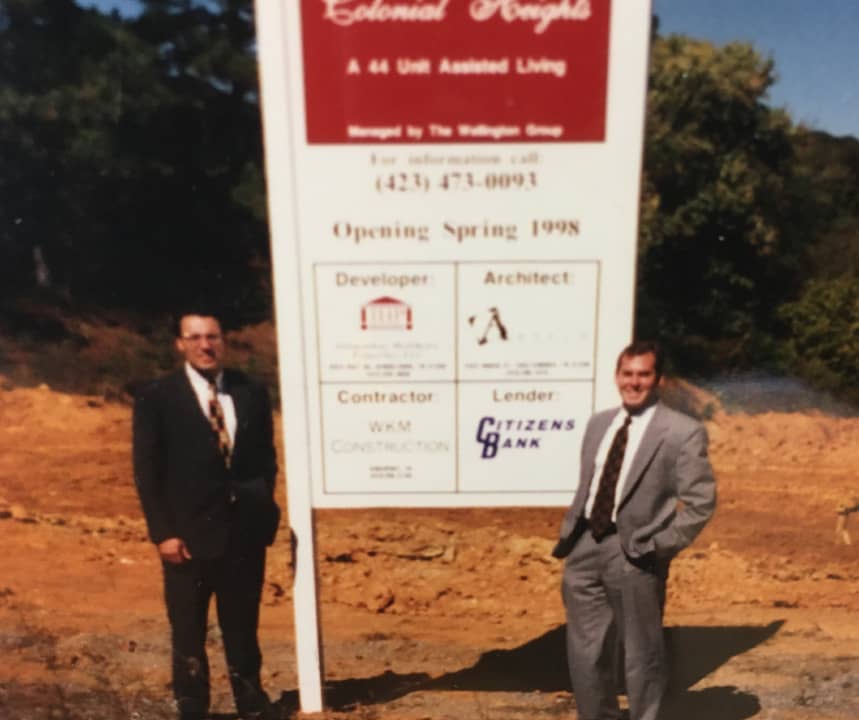 Greg Vital and Franklin Farrow Standing Outside next to a plot of land for their next business venture