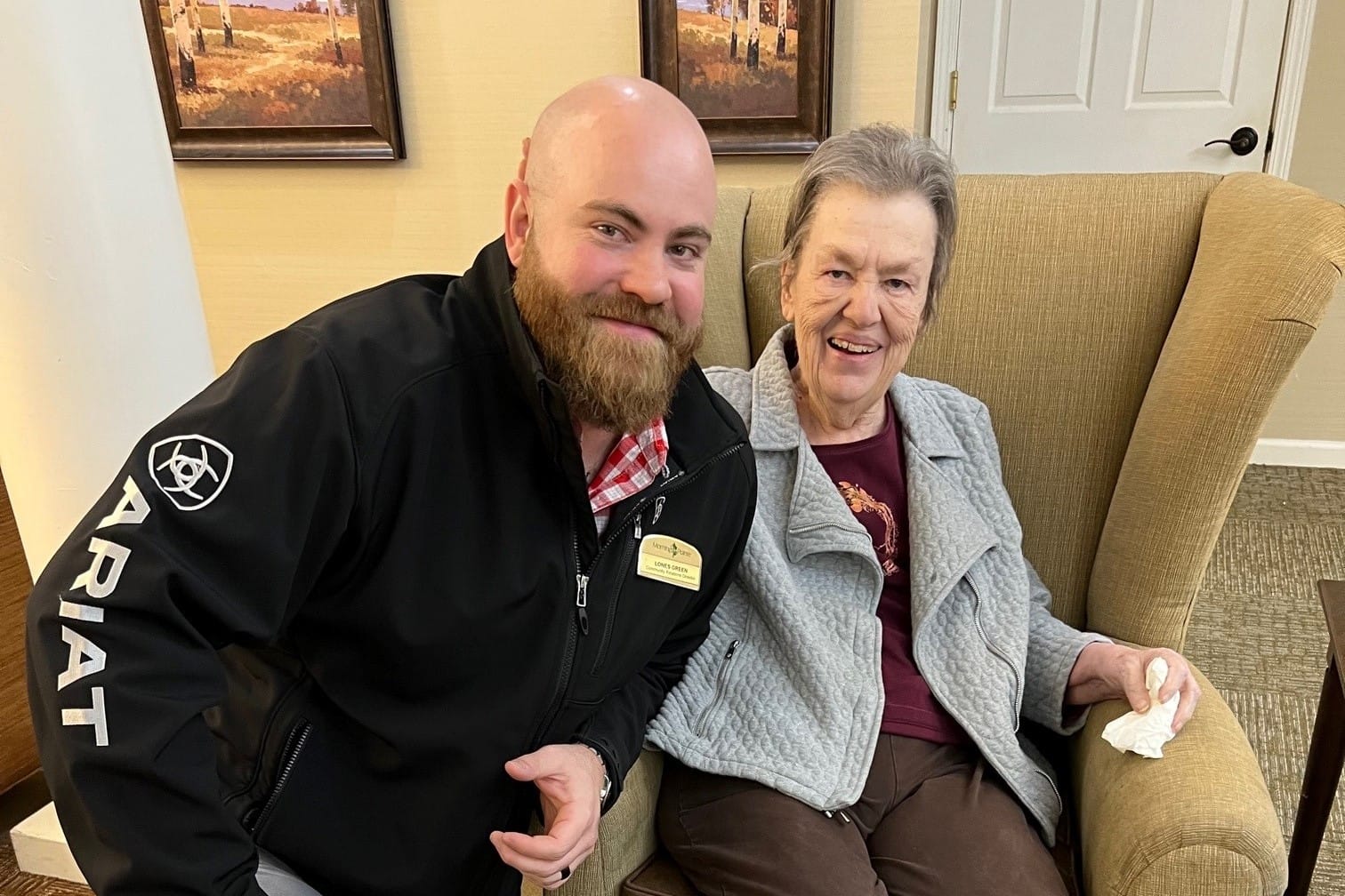 photo of Lones Green, Community Relations Director, with a resident