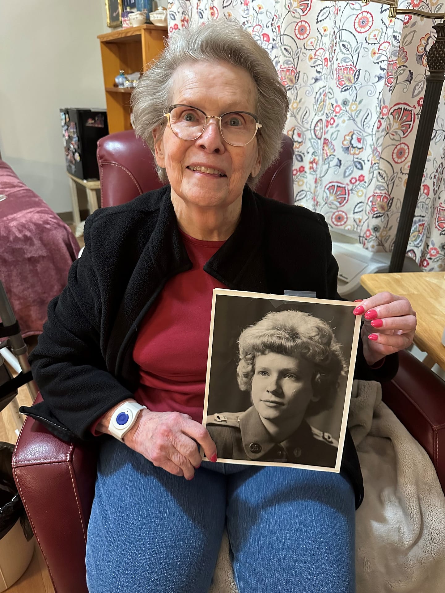 photo of Rosemarie holding her Army portrait