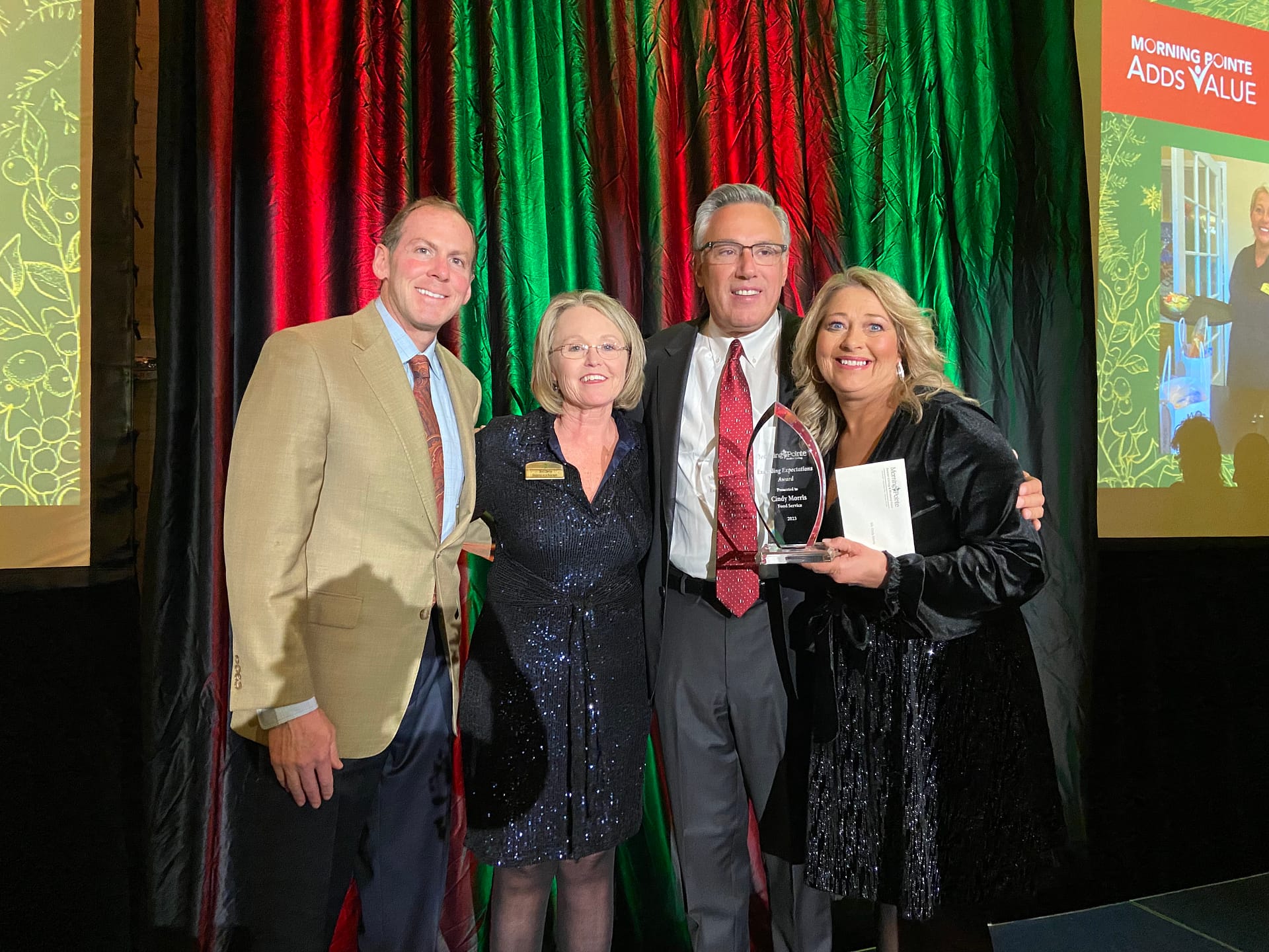 Photo, Left to right: Franklin Farrow, Morning Pointe Senior Living Co-Founder and CEO; Staci Dennis, Vice President of Morning Pointe's Bluegrass Region; Greg A. Vital, Morning Pointe Co-Founder and President; and Cindy Morris, Food Service Director at Morning Pointe of Russell and Exceeding Expectations winner for Food Service