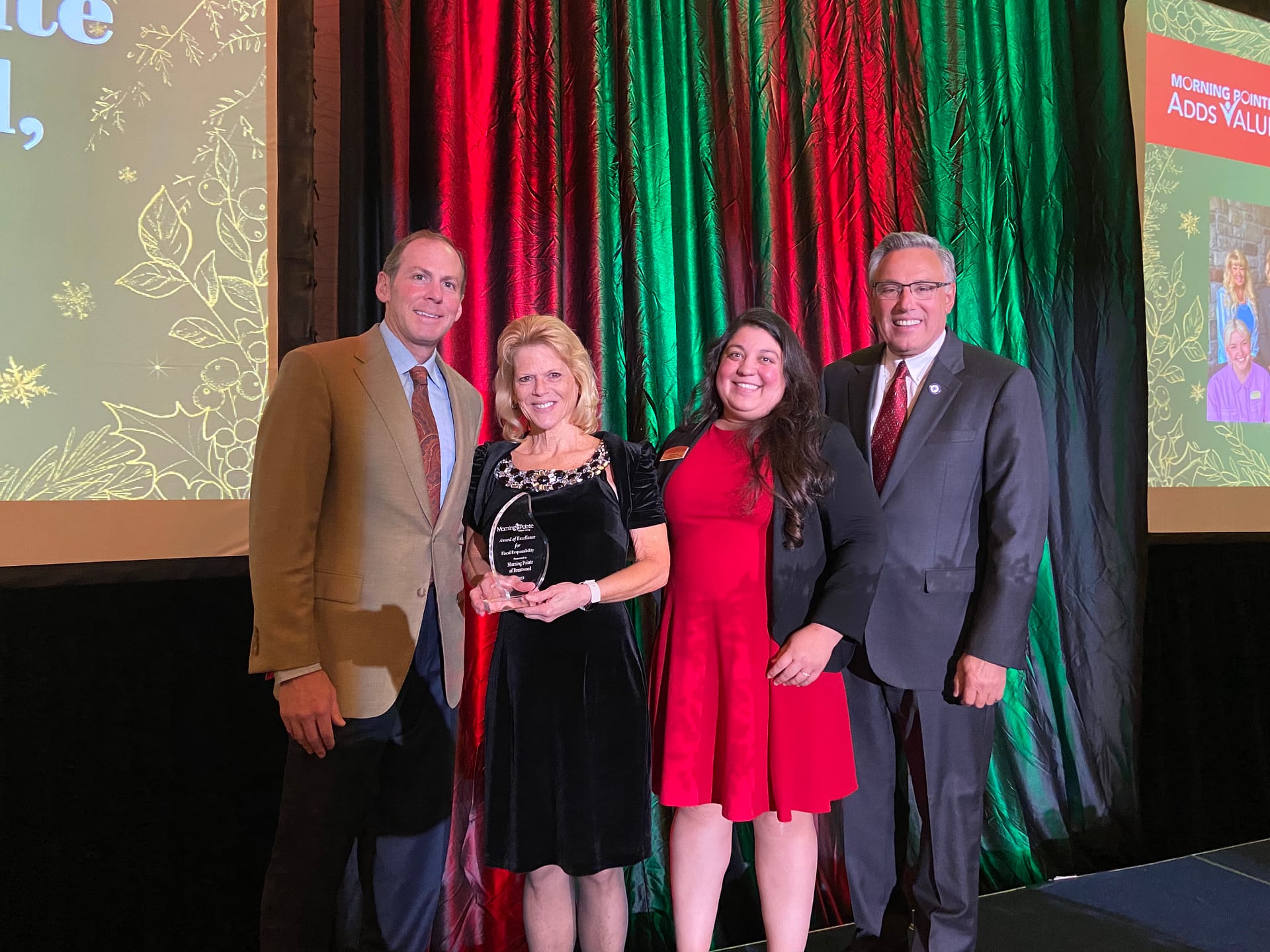 Left to right: Franklin Farrow, Morning Pointe Senior Living Co-Founder and CEO; Lisa Melby, Executive Director of Morning Pointe of Brentwood, winner of the Fiscal Responsibility Award; Lauren Lee, Senior VP of Accounting; and Greg A. Vital, Morning Pointe Senior Living Co-Founder and President