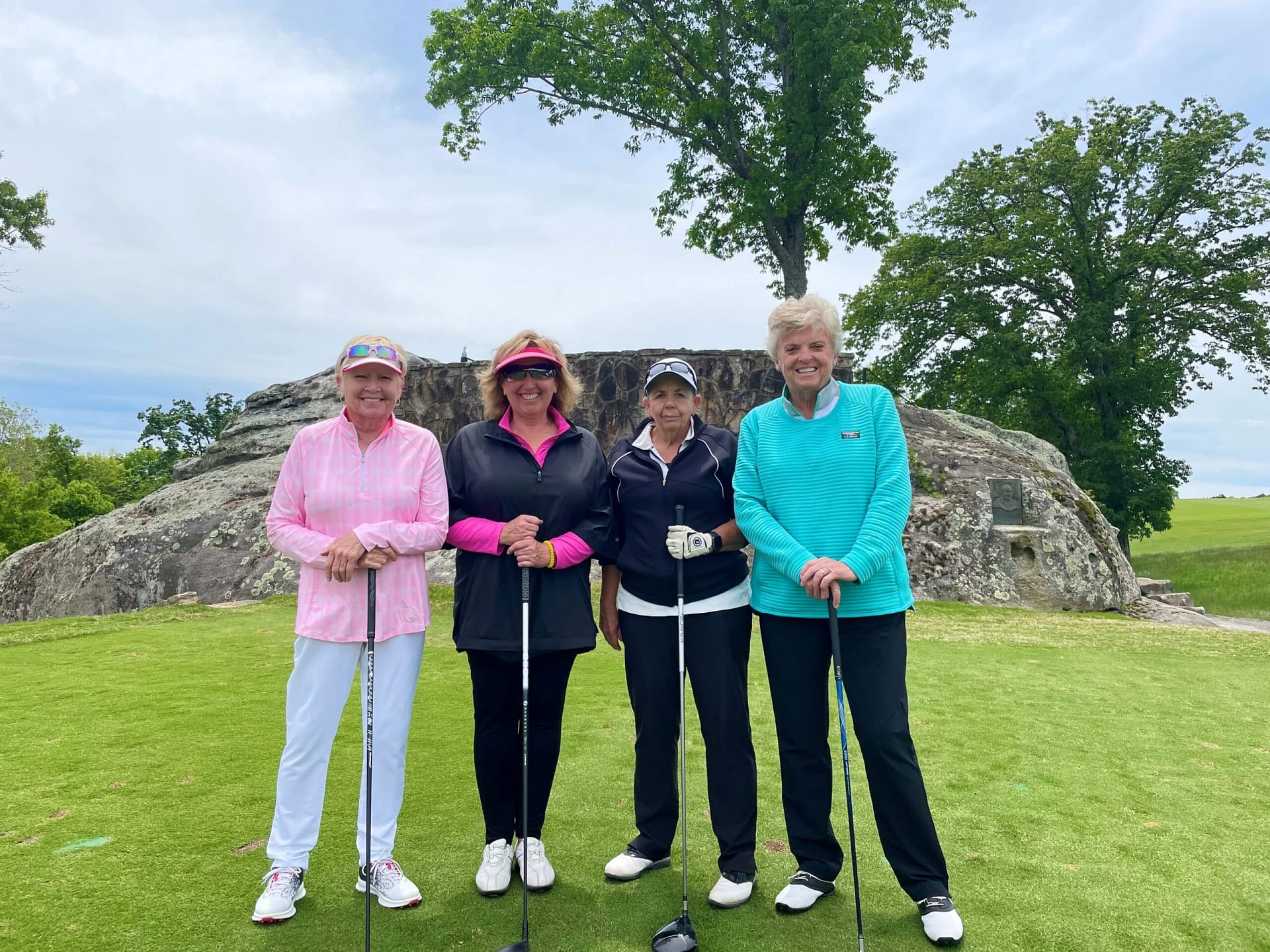 4 Senior ladies playing golf together