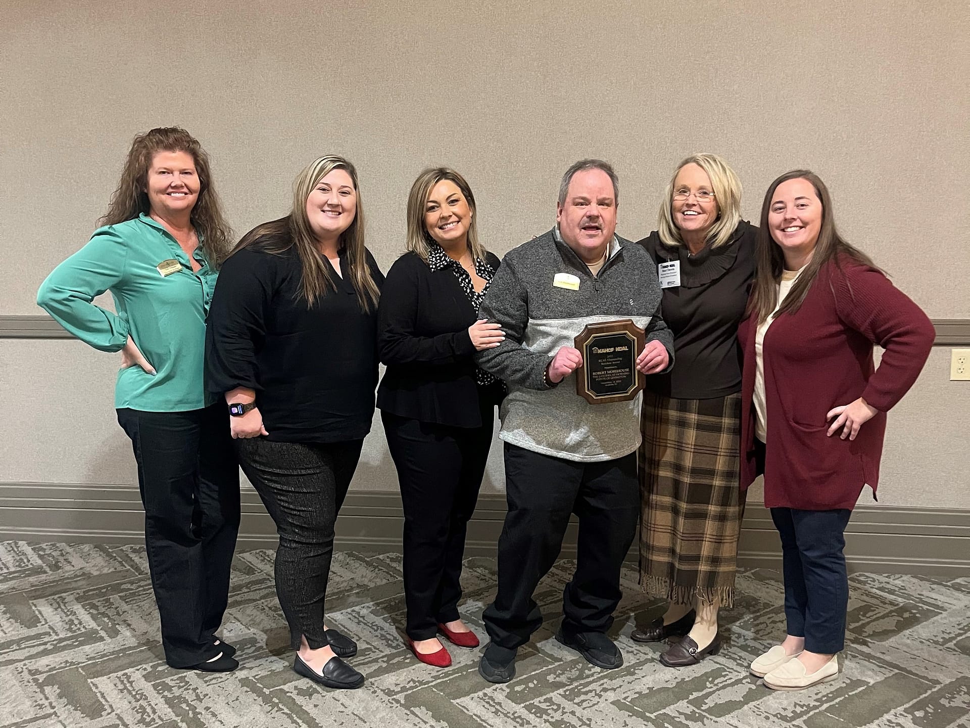 photo of Bob Morehouse, winner of the Outstanding Resident Award, with his team from The Lantern at Morning Pointe of Lexington, where he resides, as well as regional associates